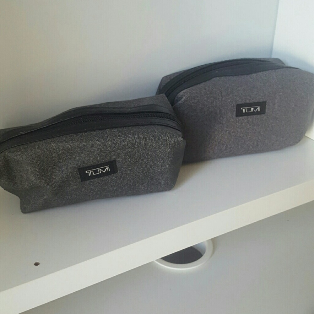 Two Tumi cosmetic bags